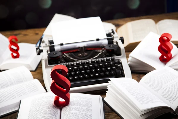 Paragraphs sign on books with typewriter — Stock Photo, Image