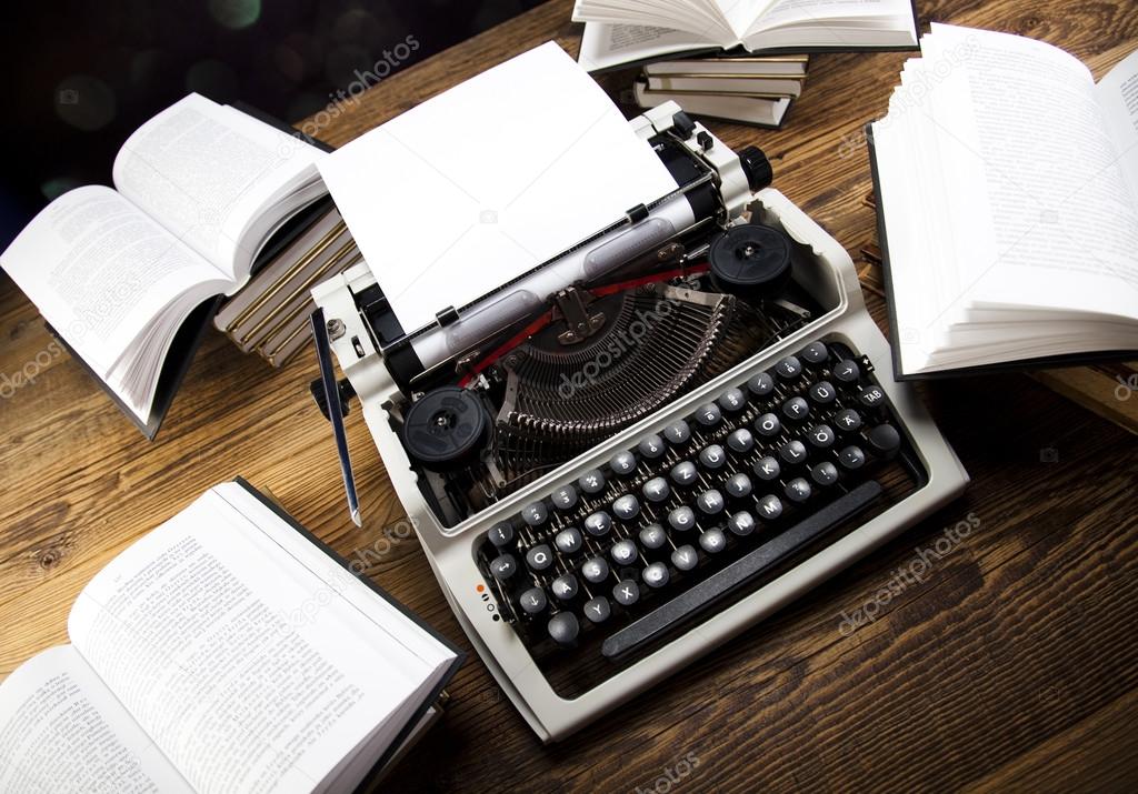 Retro typewriter with old books