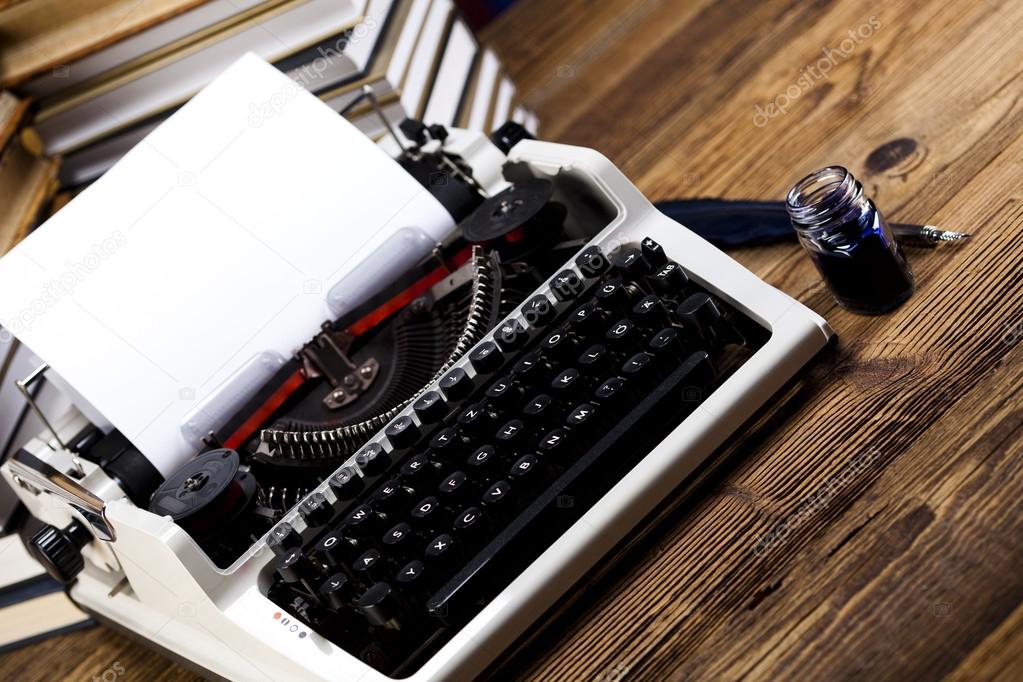Retro typewriter, feather and ink