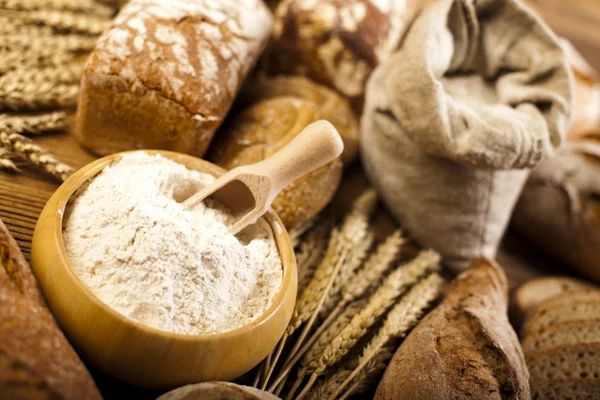 Baked loafs of bread with flour — Stock Photo, Image