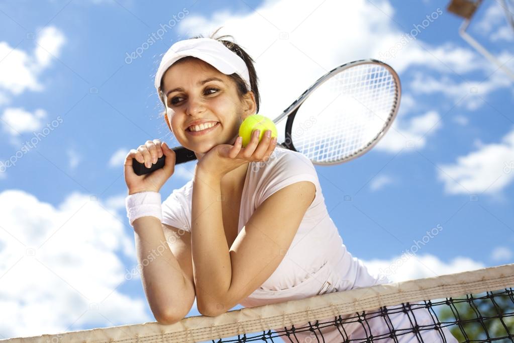 Girl rests on a tennis net