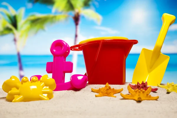 Plastic toys on the beach — Stock Photo, Image