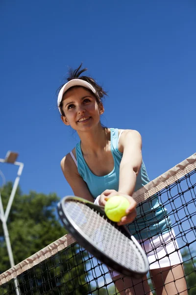 Woman playing tennis Stock Image