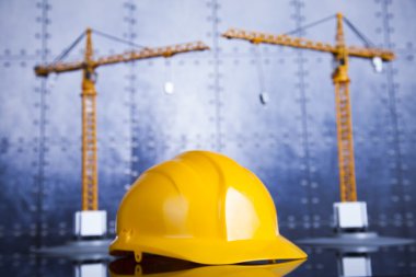 Construction plan with a crane and yellow helmet clipart