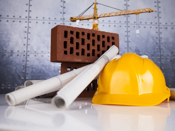 Crane, Safety helmet, Blueprints and construction site — Stock Photo, Image