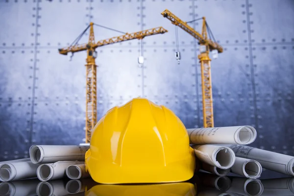 Crane, Safety helmet, Blueprints and construction site — Stock Photo, Image