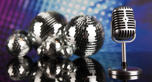 Retro style microphone and disco balls — Stock Photo, Image