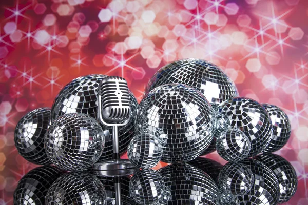 Retro style microphone and disco balls — Stock Photo, Image