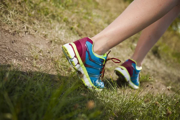 Runner feet running on road closeup on shoe — Stock Photo, Image