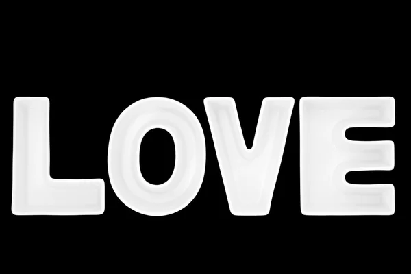 Kärlek i vit porslin bokstäver — Stockfoto