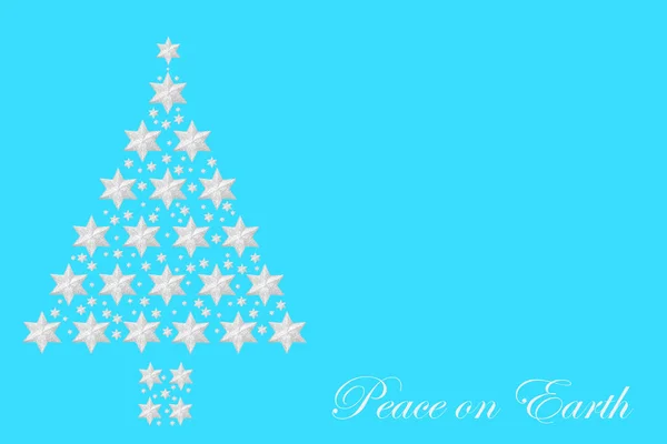 圣诞树银星构图与和平地球短语在淡蓝色背景上 节日设计的概念 — 图库照片