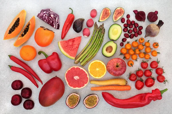 Plant based fruit & vegetables high in lycopene for a healthy heart with foods high in antioxidants,  anthocyanins, vitamins, omega 3, minerals & dietary fibre. Ethical eating for a healthy planet. Flat lay.