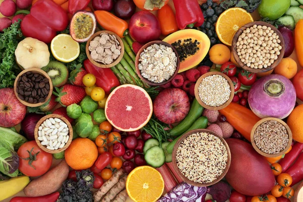 Antioxidant health foods to lower cholesterol & blood pressure with fruit, vegetables, cereals, legumes & grains high in fibre, anthocyanins, lycopenes, carotenoids, vitamins & minerals. Flat lay, top view.