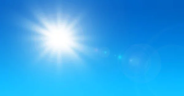 Sun with lens flare and blue sky, summer or spring natural background as nature hot sunny day.