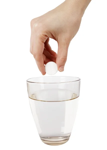 Effervescence tablet and a glass of water — Stock Photo, Image