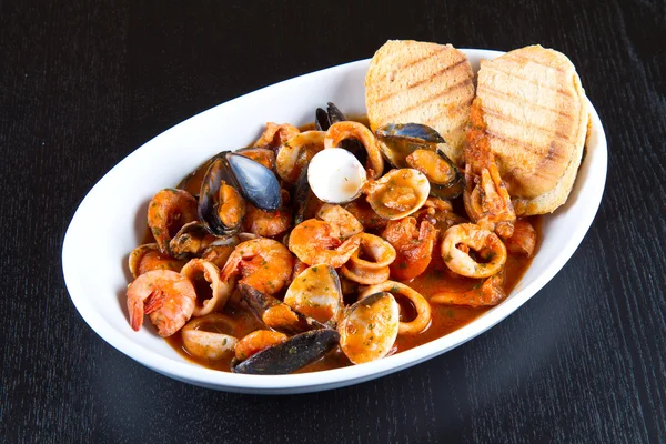 Fresh seafood soup with roasted bread — Stock Photo, Image