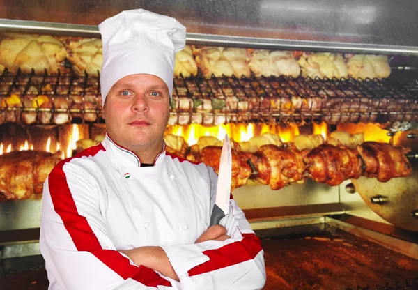 Fiducioso chef maschio in uniforme bianca — Foto Stock