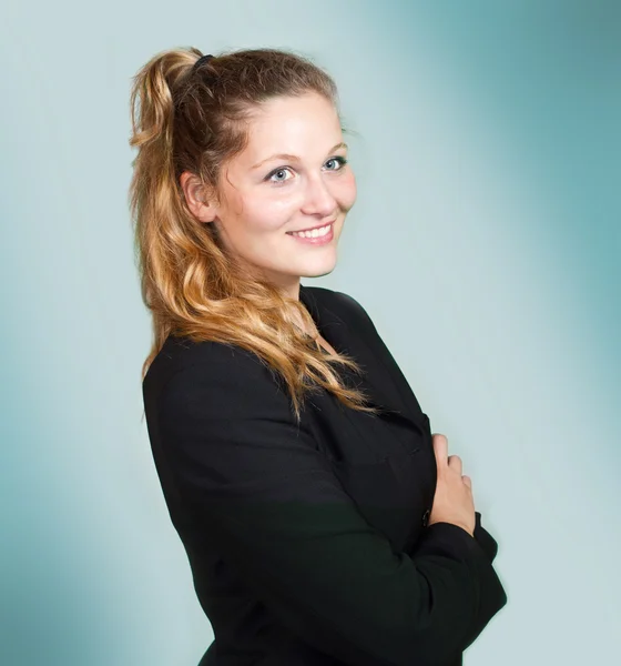 Smiling girl isolated on blue — Stock Photo, Image