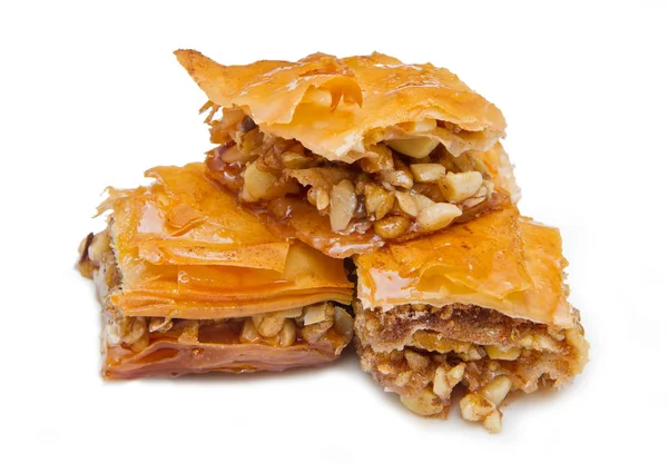 Bit baklava godis på vit bakgrund — Stockfoto