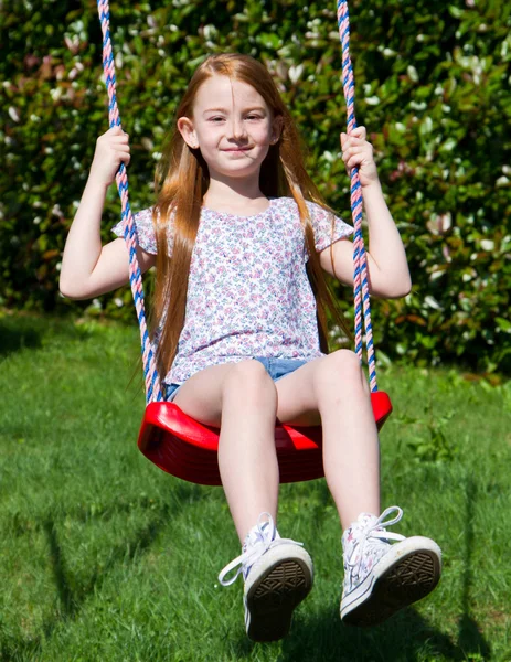 Little girl on the swing — Stock Photo, Image