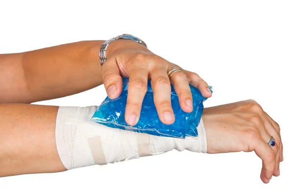 Woman's arm with bandage and ice painkiller — Stock Photo, Image