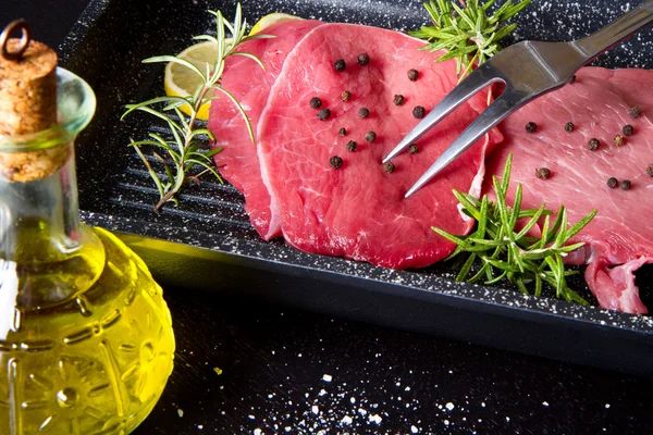 Raw sliced beef on plate pot — Stock Photo, Image