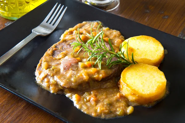 Braised meat with polenta — Stock Photo, Image