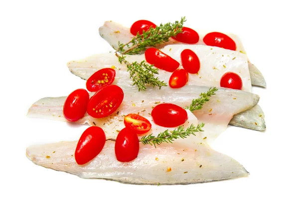 Raw sea bass fillets with tomatoes — Stock Photo, Image