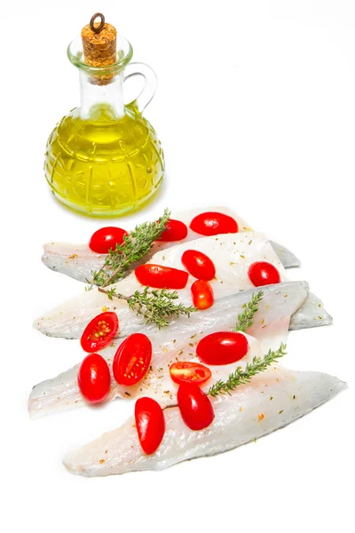 Raw sea bass fillets with tomatoes — Stock Photo, Image