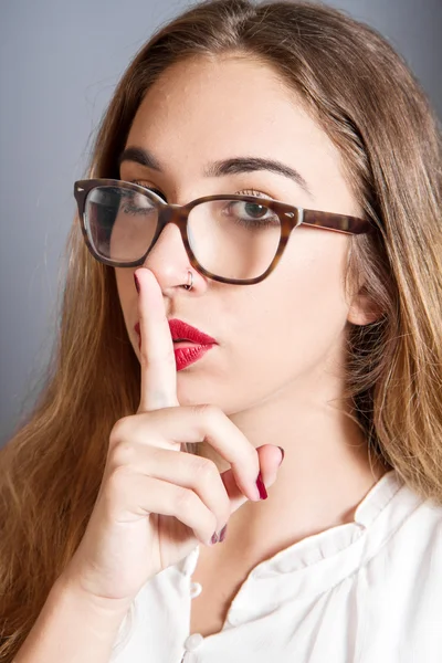 Girl with finger on lips — Stock Photo, Image