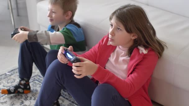 Pretty Little Girl Boy Playing Game Console Laugh Sit Floor — Vídeo de stock