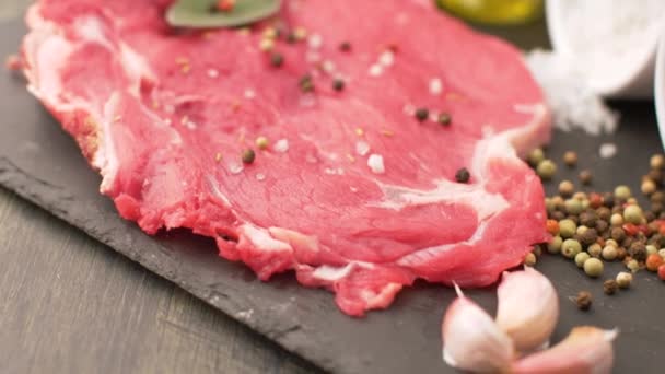 Delicious Raw Steak Rib Salt Pepper Oil Slate Plate — Stock Video