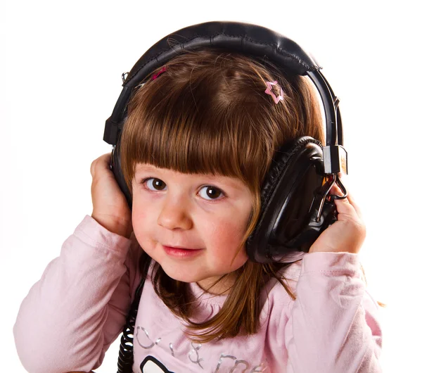 Linda menina feliz bonito com fones de ouvido — Fotografia de Stock