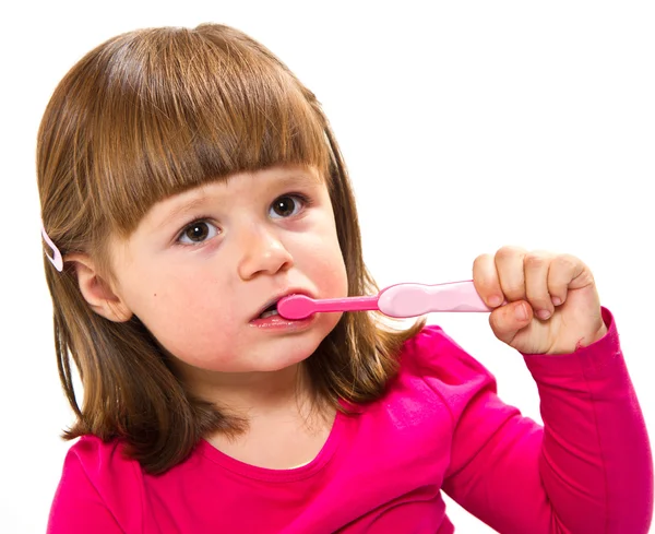 Malá dívka čištění zubů Stock Obrázky