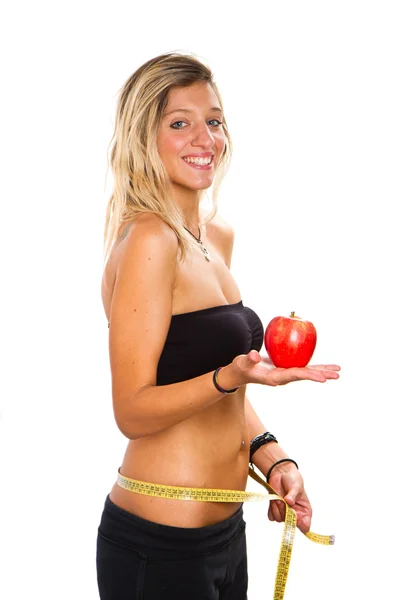Uma menina magra medindo sua cintura — Fotografia de Stock