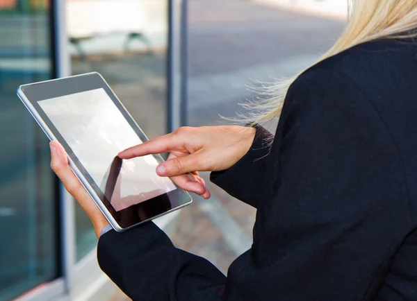 Female hands touching digital tablet — Stock Photo, Image