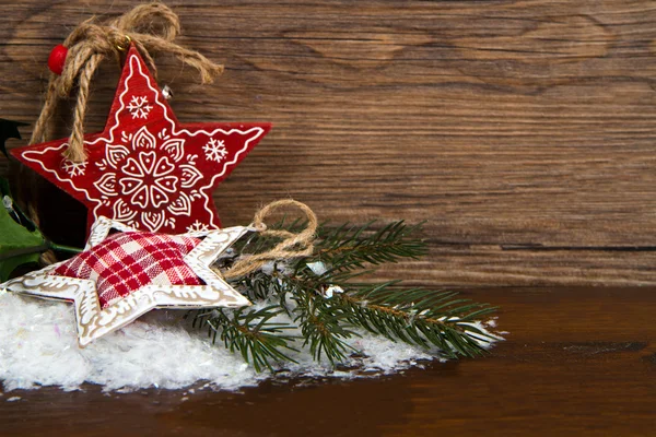 Dřevěný vánoční hvězda dekorace na dřevěné pozadí — Stock fotografie
