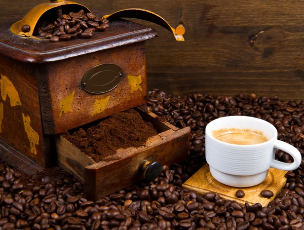 Coffee Grinder with Beans and coffee cup — Stock Photo, Image