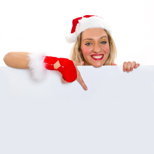 Schöne Weihnachtsfrau mit Weihnachtsmütze und leerem Brett — Stockfoto