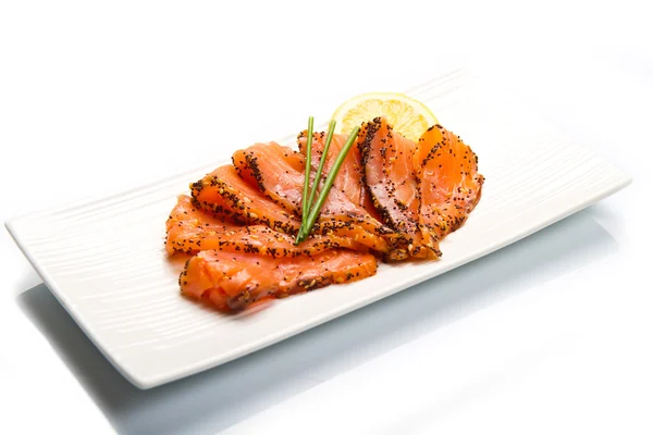 Smoked salmon on white dish with chive — Stock Photo, Image