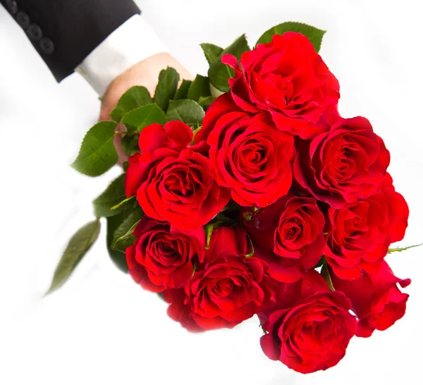 Man's hand with red roses bouquet — Stock Photo, Image