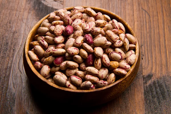 Pinto beans on wood bowl — Stock Photo, Image