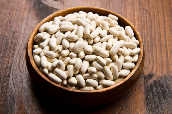 Cannellini beans on wood bowl — Stock Photo, Image