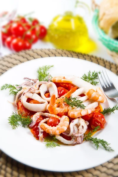 Dish with tomatoes and squid — Stock Photo, Image