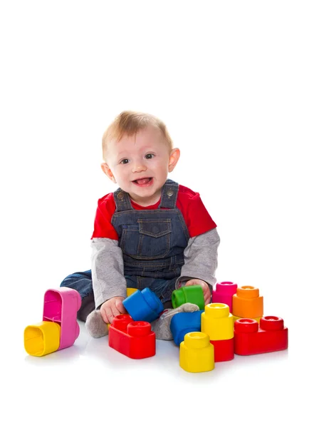 Little boy playing with colored soft cube — Stock Photo, Image