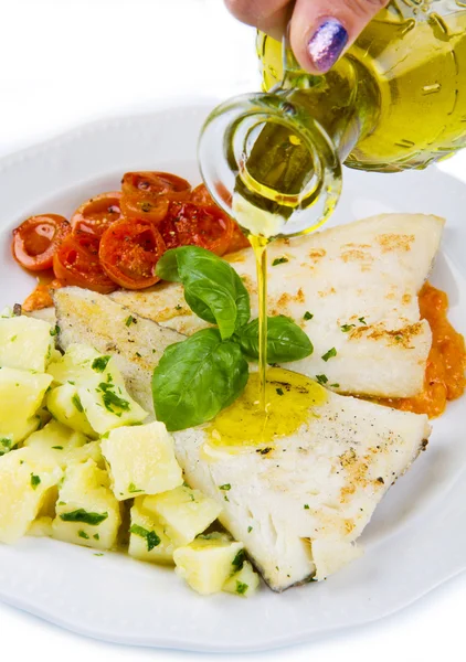 White dish of Fresh black cod with potatoes and tomatoes sauce — Stock Photo, Image