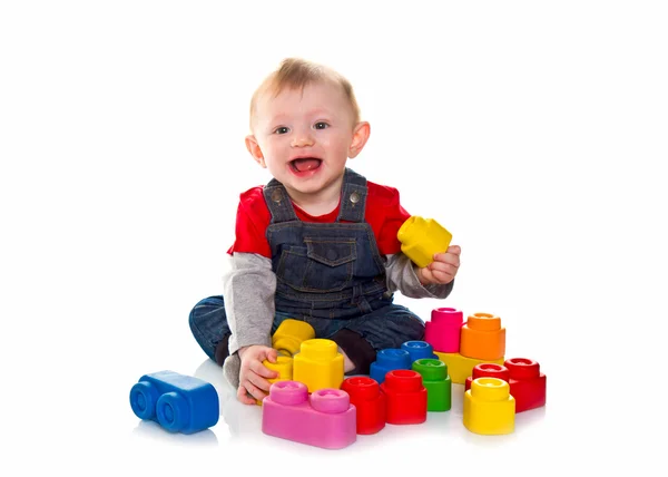 Little boy playing with colored soft cube — Stock Photo, Image