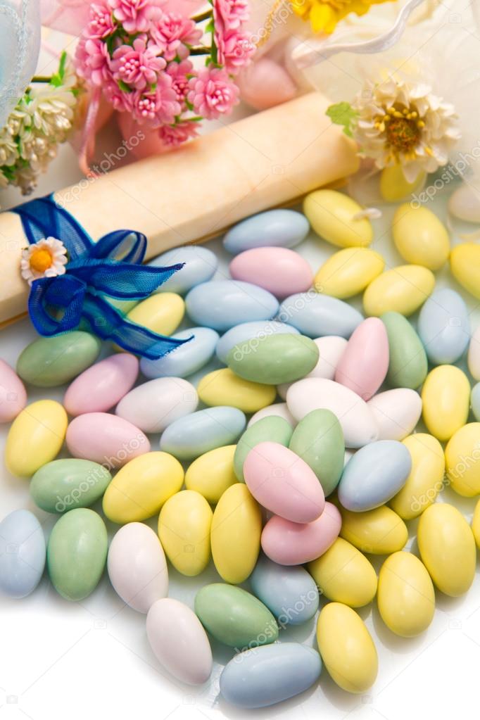  sugared almonds color blue, rose,  yellow  and white.