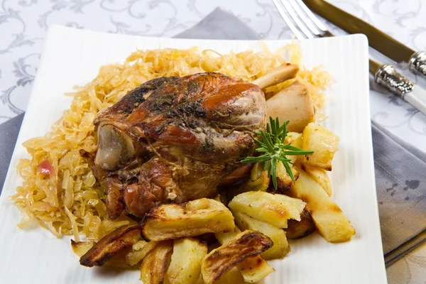 Baked pork shank with sauerkraut — Stock Photo, Image