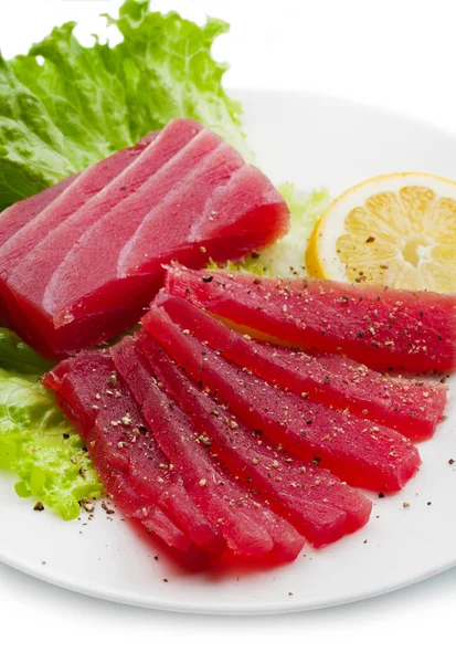 Slices of raw bluefin tuna  sashimi on white dish — Stock Photo, Image